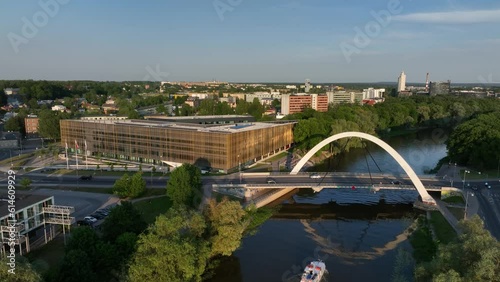 Tartu city centre, a boat passes under the Freedom Bridge, which was opened on 30 July 2009. Tartu - the 2024 European Capital of Culture. Estonia.