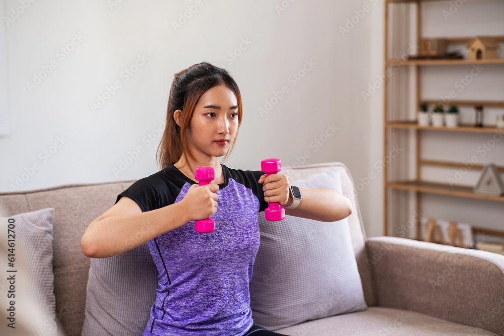 Asian woman exercising at home with swiss ball. home exercise concept. Asian woman exercising at home with swiss ball. home exercise concept.