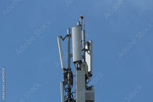 Mobile communication antenna against the blue sky.