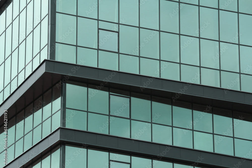 Abstract urban background. Mirror windows of a multi-storey business center or office building. Abstract urban background. Mirror windows of a multi-storey business center or office building.