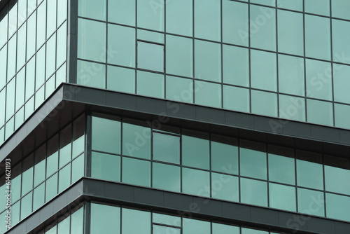 Abstract urban background. Mirror windows of a multi-storey business center or office building.