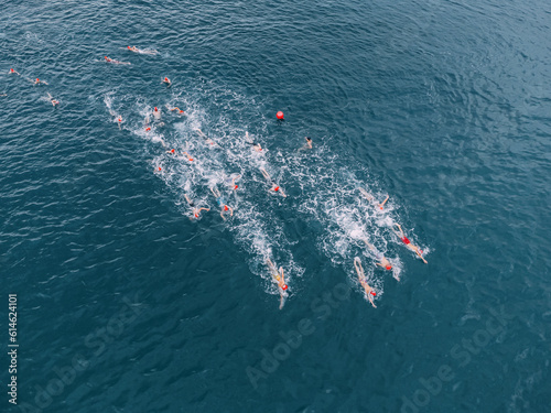 Aerial view of athletes at open water sea swimming competitions © EdNurg