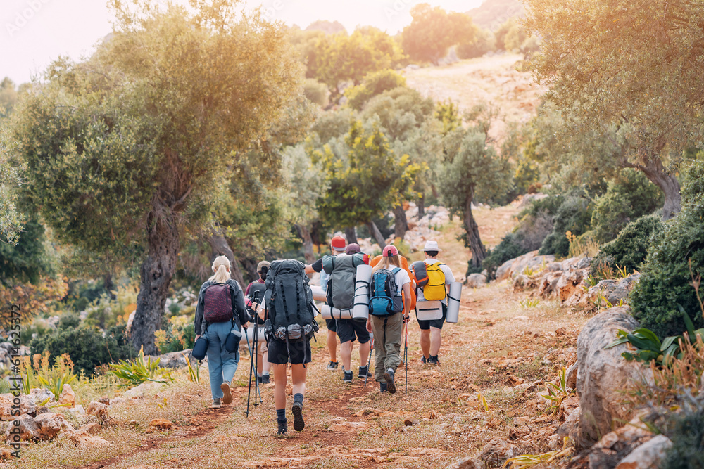 Group of hikers walking by the Lycian Way footpath in turkish countryside