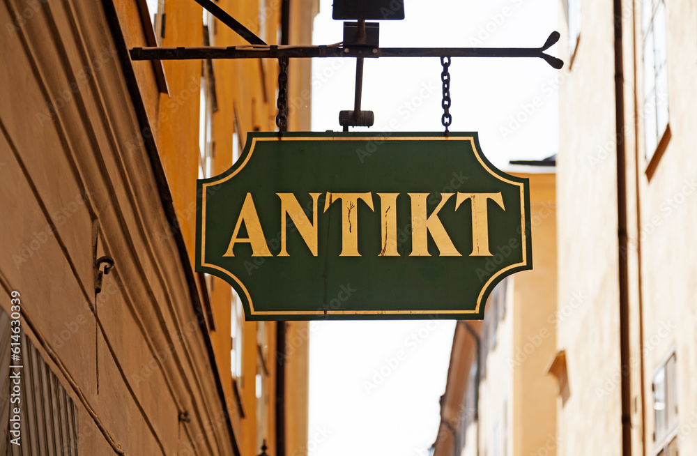 a sign with the text antique in Swedish a sign with the text antique in Swedish