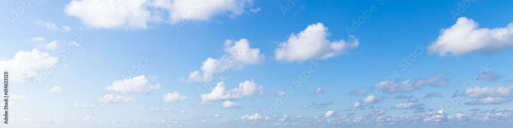 Blue sky with white cumulus clouds on a sunny day. Natural panorama Blue sky with white cumulus clouds on a sunny day. Natural panorama