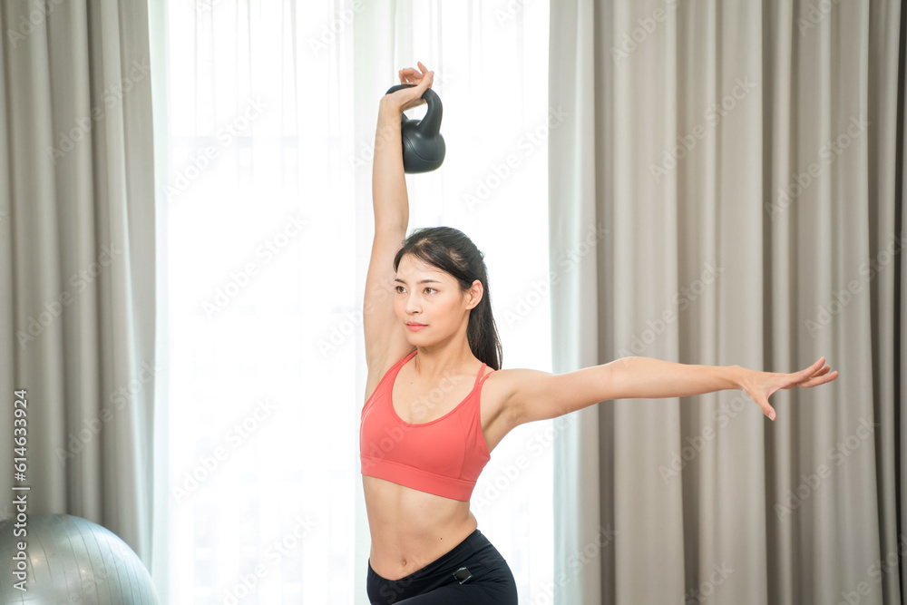 Sporty woman with do abdominal exercises with wheel,Workout exercise to lose weight at home,Sport and recreation concept.
