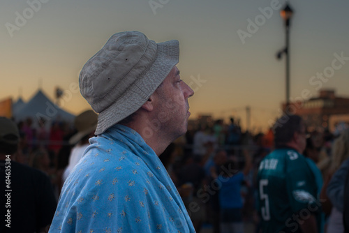 Male watching the band at the beach