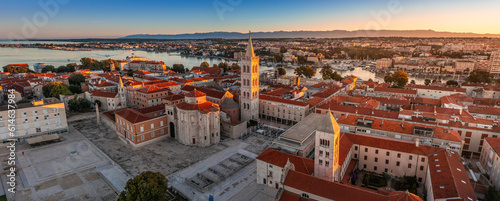 Zadar, Croatia - Aerial panoramic view of the Forum of the old town of Zadar with the Church of St. Donatus and the bell tower of the Cathedral of St. Anastasia on a summer morning with golden sunrise