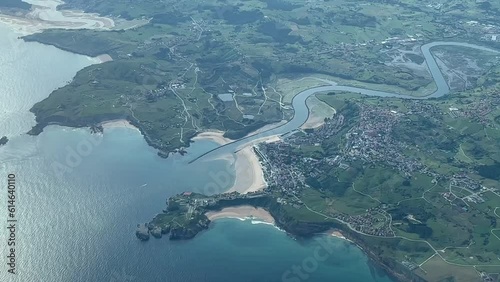 Aerial view of Suances bay, near Torrelavega, in Santander, Spain. Shot from an airplane cabin during a left turn at 5000m high. A pilot’s perspective. photo