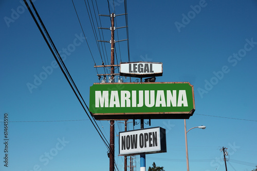 Aged and worn urban legal marijuana sign 