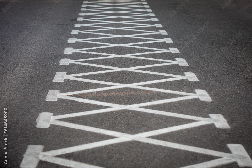 White painted lines on asphalt for road traffic White painted lines on asphalt for road traffic