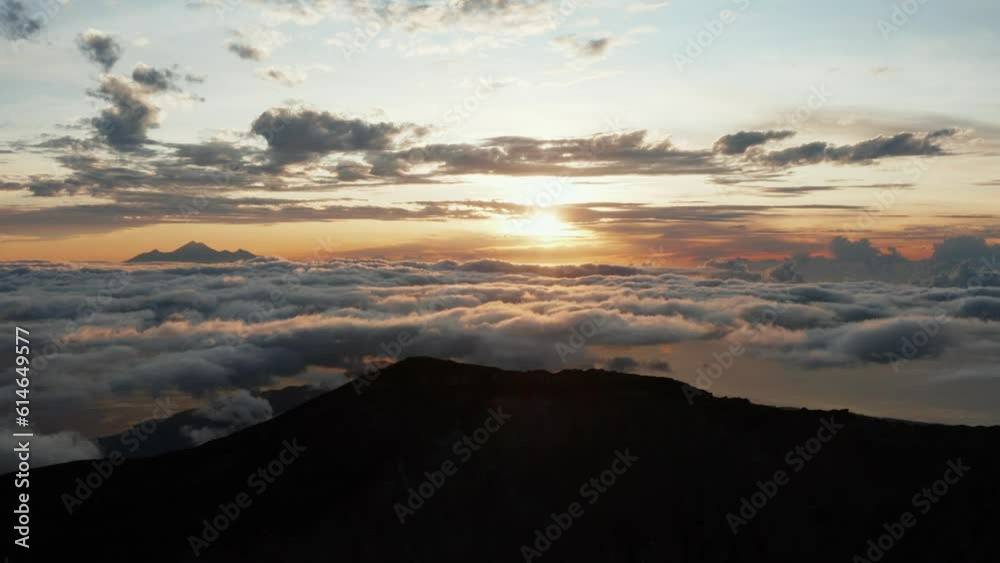 Drone Flying Over Mountain Top at Sunrise. Forward Movement. Mountain silhouette in the background. 4k Footage. Drone Flying Over Mountain Top at Sunrise. Forward Movement. Mountain silhouette in the background. 4k Footage.