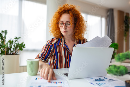 Businesswoman Sitting at Her Desk Working on Laptop Computer in Big City Office. Confident Social Media Strategy Manager Plan Disruptive e-Commerce Campaign