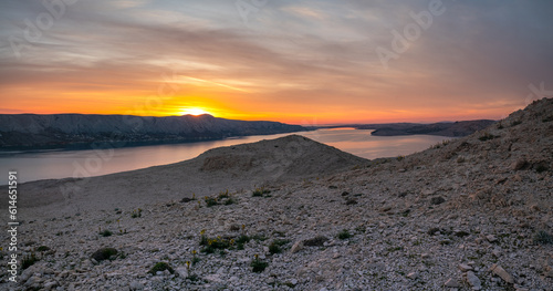 The rugged  rocky landscape of the island of Pag in Croatia shown during a beautiful sunset