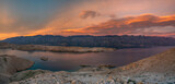 The rugged, rocky landscape of the island of Pag in Croatia shown during a beautiful sunset