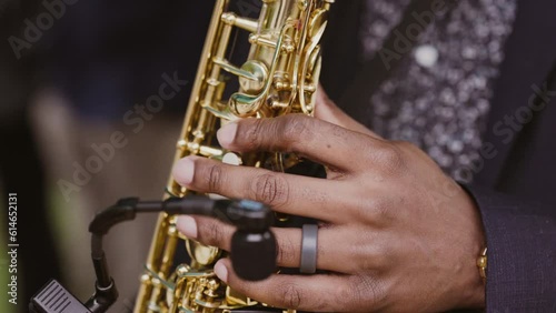 Close-up of a black man playing jazz on saxophone