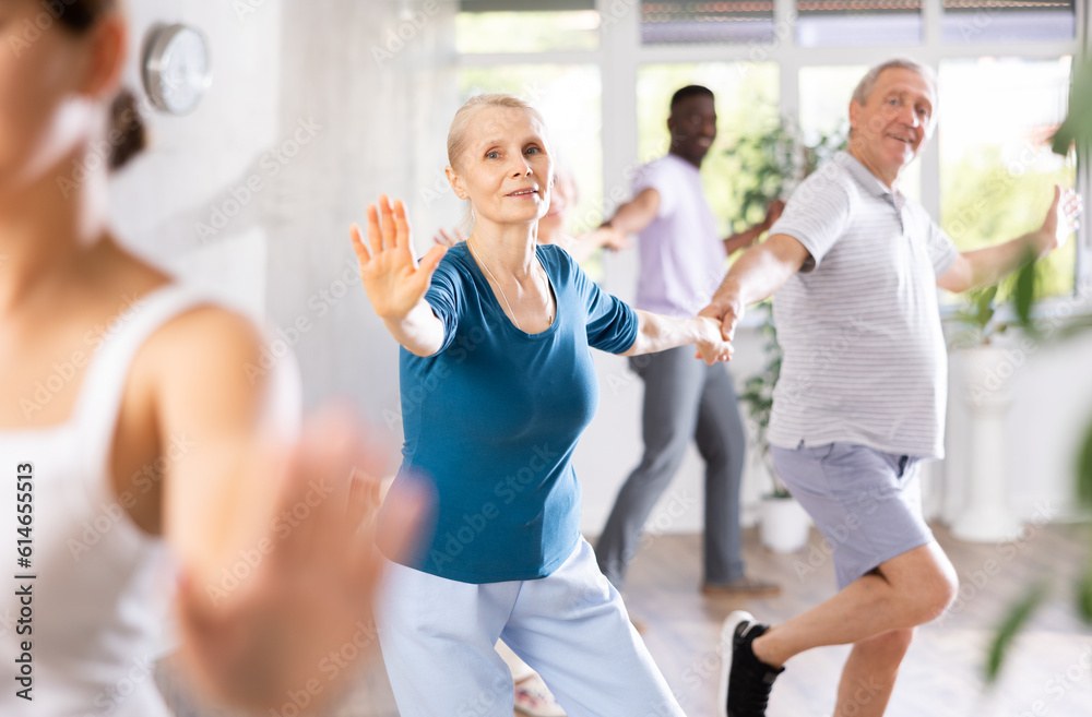 Senior europian man is enjoying his hobby of dancing salsa with his elderly partner at fitness class, relishing in movement and activity. It great way for them to stay active and have fun together.