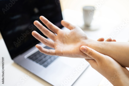 Asian young woman suffering from peripheral neuropathy,disease of nerves,symptoms of numbness or weakness in hands,beriberi in fingers or fingertips,Carpal Tunnel Syndrome,health care,medical concept photo