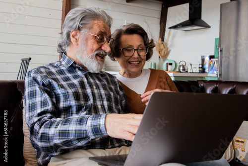 Mature pensioners man and woman using technology - isolation and quarantine lifestyle