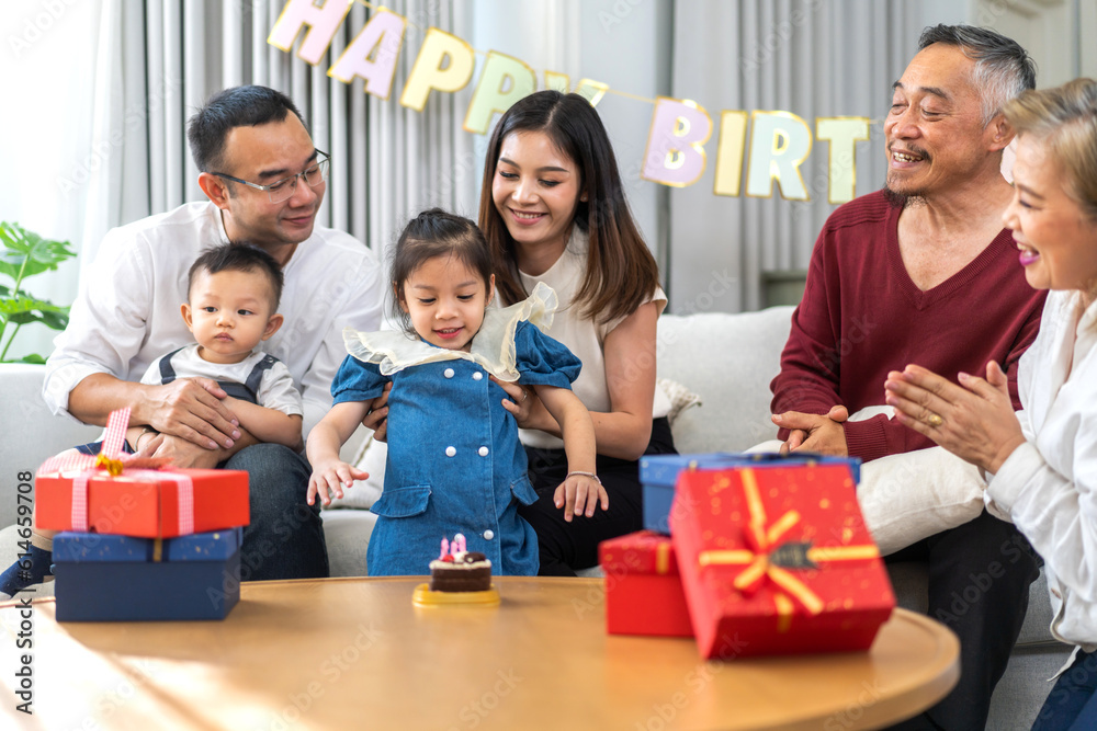 Portrait of happy love asian big family father and mother with asian baby and little girl happy birthday, party, celebration, cake, surprise, grandfather with grandmother smiling together.Family party Portrait of happy love asian big family father and mother with asian baby and little girl happy birthday, party, celebration, cake, surprise, grandfather with grandmother smiling together.Family party