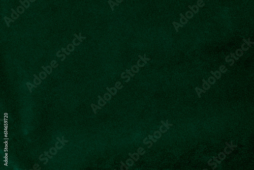 Green velvet fabric texture used as background. green fabric background of soft and smooth textile material. There is space for text.. © Sittipol 