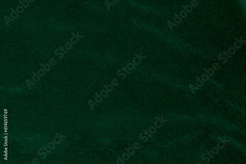 Green velvet fabric texture used as background. green fabric background of soft and smooth textile material. There is space for text..