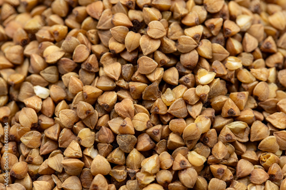 Pile of buckwheat grains as background, spice or seasoning as background. close-up buckwheat Pile of buckwheat grains as background, spice or seasoning as background. close-up buckwheat