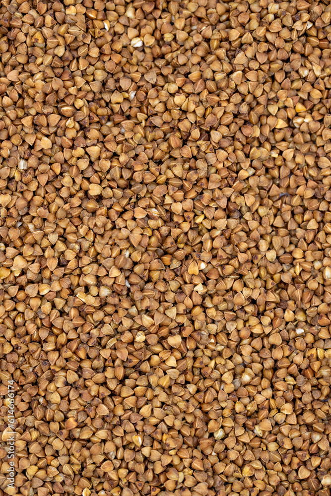 Pile of buckwheat grains as background, spice or seasoning as background. close-up buckwheat Pile of buckwheat grains as background, spice or seasoning as background. close-up buckwheat