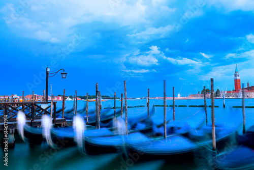 Venice gondolas long exposure . Traditional boats moored in Venezia