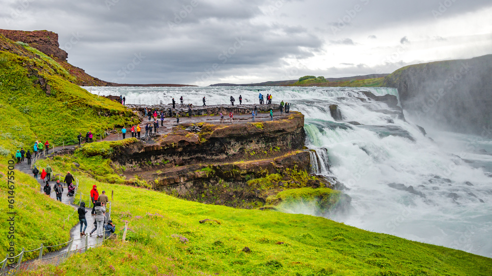 Wonderful waterfall Gullfoss, Golden waterfall in South West Iceland, with many tourists - obrazy, fototapety, plakaty 