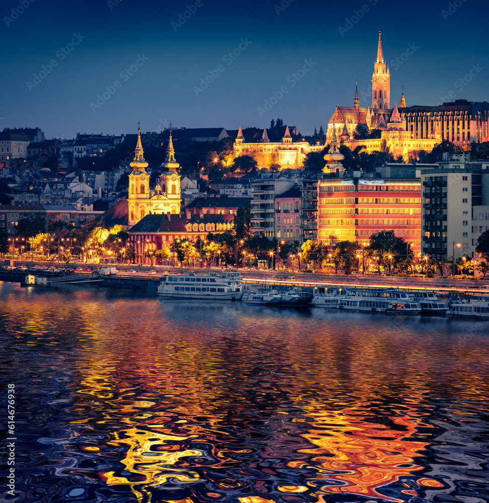 Fototapeta premium Great night view of Fisherman's Bastion and Szent Ferenc sebei templon church. Illuminated spring scene of Budapest, capital of Hungary, Europe.Traveling concept background..
