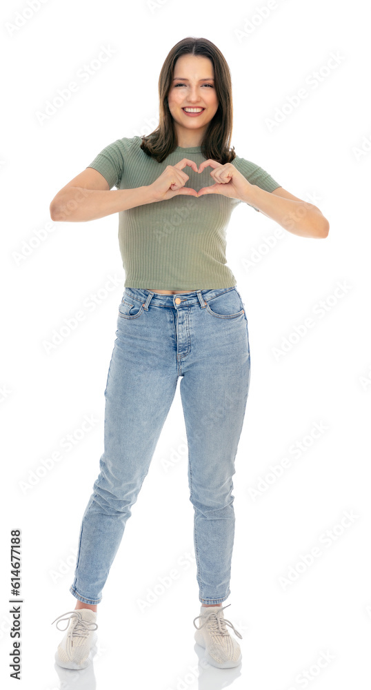 Full-length portrait of young caucasian woman with romantic shapes heart gesture expresses tender feelings, isolated on white background. People affection and care concept.
