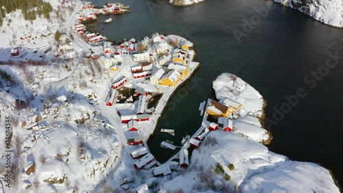 4k drone flight moving to the side footage (Ultra High Definition) of Nusfjord town, Norway, Europe. Aerial winter scene of Lofoten Islands. Bright morning seascape of Norwegian seascape.