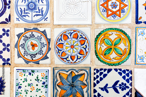 Beautiful italian maiolica background, tin-glazed tiles decorated in colours on a white background. Or azulejos, majolica with geometric or figurative elements.