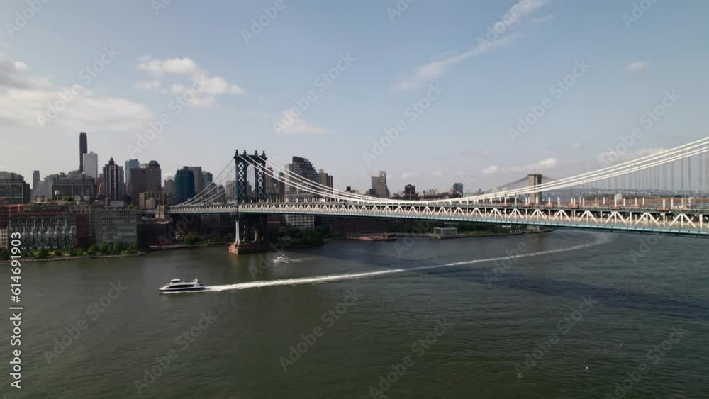 NYC transit public ferry on the East River, Manhattan Bridge. 4K drone. NYC transit public ferry on the East River, Manhattan Bridge. 4K drone.