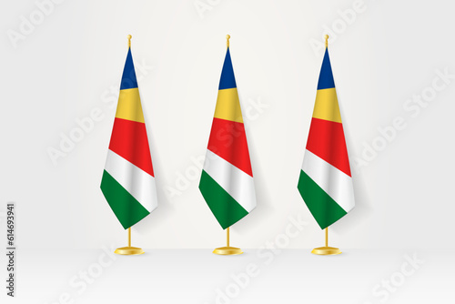 Three Seychelles flags in a row on a golden stand, illustration of press conference and other meetings.