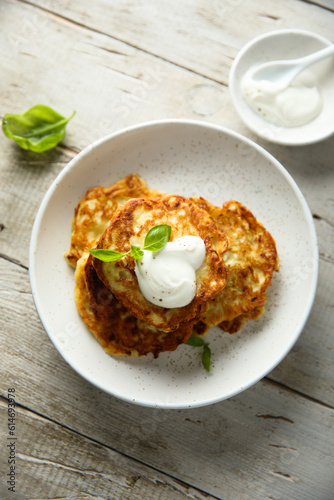 Traditional homemade latkes with sour cream