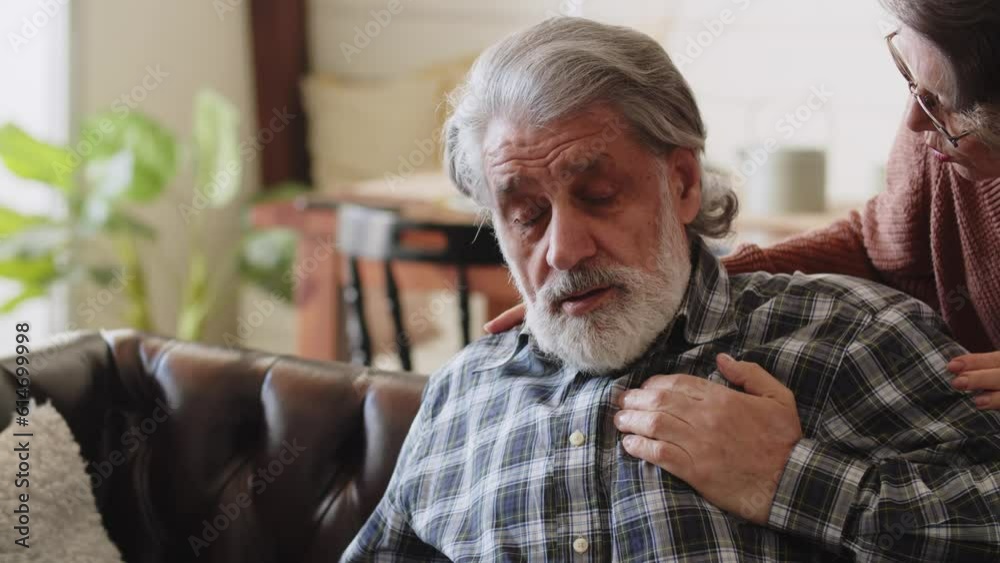 Older man having chest pains. Mature man suffering from chest pain at home. The concept of people with heart problems