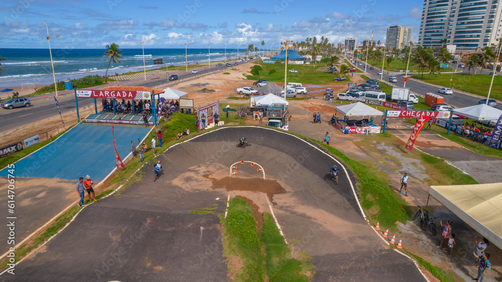 Drone view of curve with competitors in bmx race
