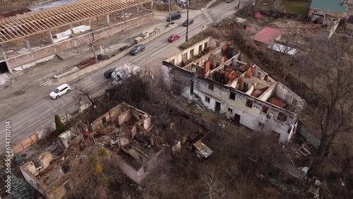 Drone shot over a destroyed residential building after Russian shelling in Ukraine, Bucha - Kyiv Oblast. photo