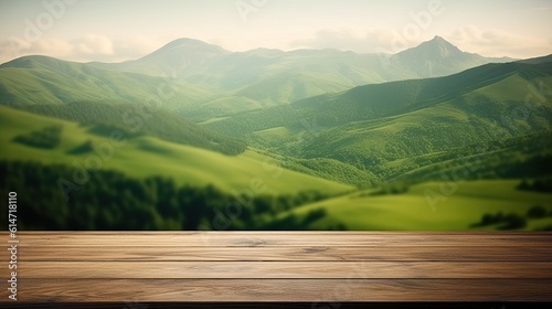 Wooden table with landscape of mountains, green hills, meadow and countryside. © Creative Clicks