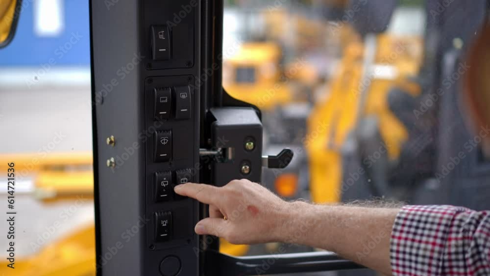 Close-up senior male hand pressing buttons in brand new agricultural harvester in slow motion. Closeup unrecognizable confident old Caucasian man choosing new vehicle sitting in tractor cabin Close-up senior male hand pressing buttons in brand new agricultural harvester in slow motion. Closeup unrecognizable confident old Caucasian man choosing new vehicle sitting in tractor cabin