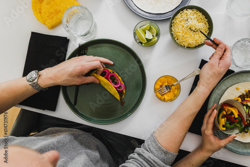 Overhead view of person assembling taco photo