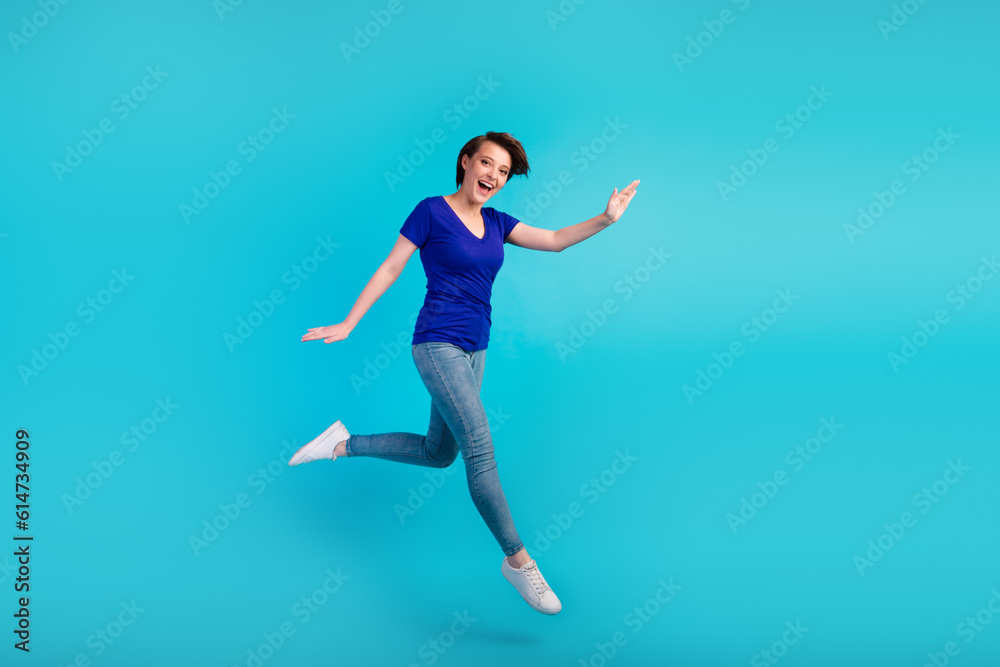 Full body photo of charming girl having fun jump high up isolated blue turquoise color background Full body photo of charming girl having fun jump high up isolated blue turquoise color background