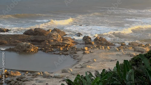 Wild beach with waves breaking on rocks, North Coast, Kwazulu Natal South Africa photo