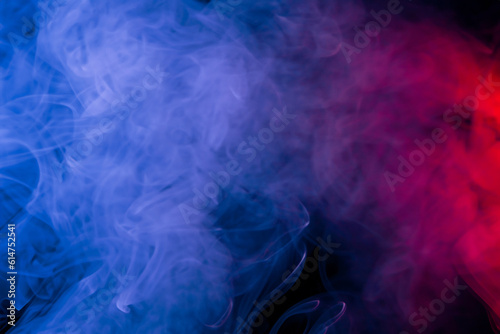 Abstract texture smoke in red blue on a black background.