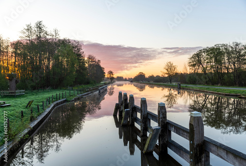 Obraz na płótnie Sunrise over the water channel in the Flevoland w salonie