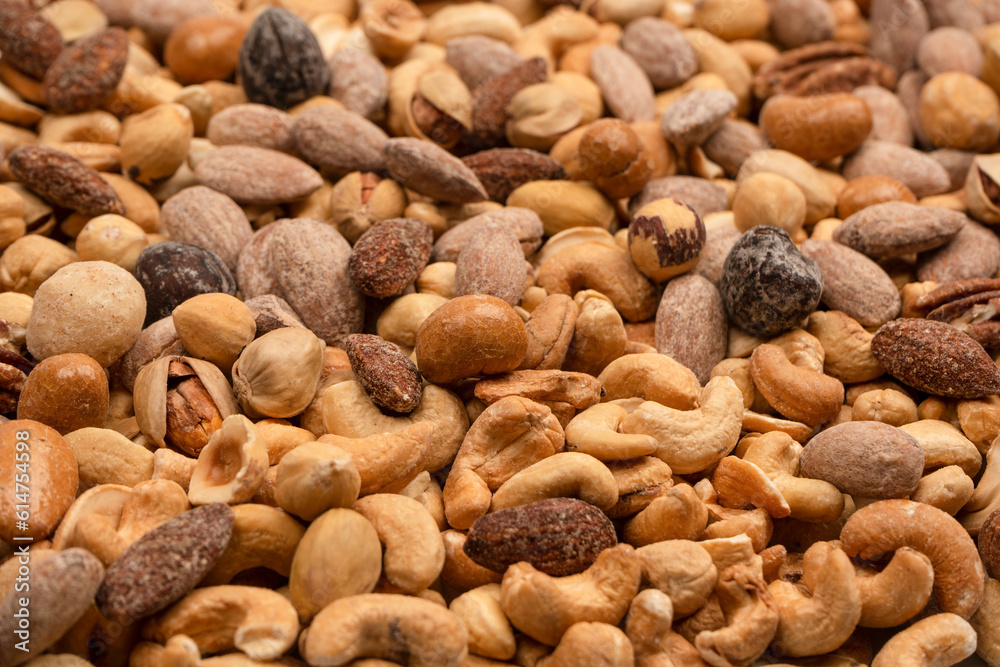 A group of almonds, pistachios, walnuts, macadamia, cashews.