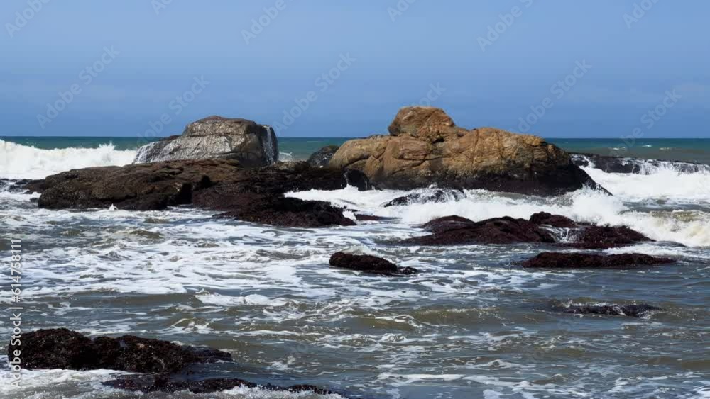 Wild beach with waves breaking on rocks, North Coast, Kwazulu Natal South Africa Wild beach with waves breaking on rocks, North Coast, Kwazulu Natal South Africa