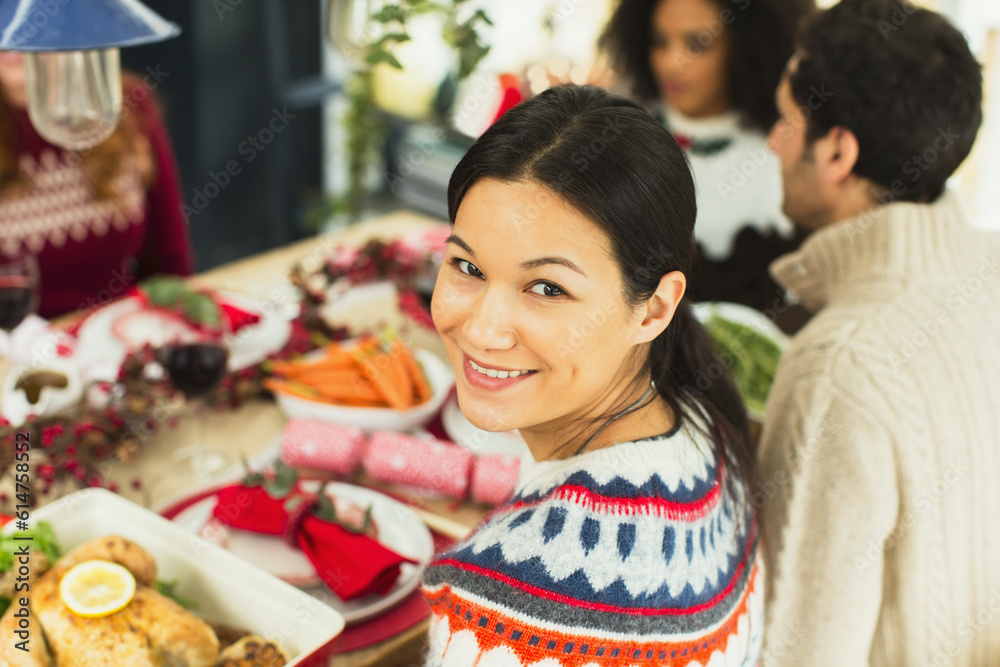 Portrait smiling woman at Christmas dinner